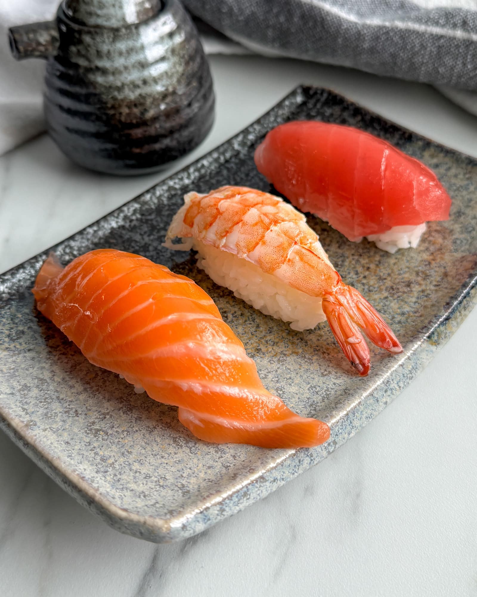 Elegant omakase nigiri sushi presentation for home preparation.