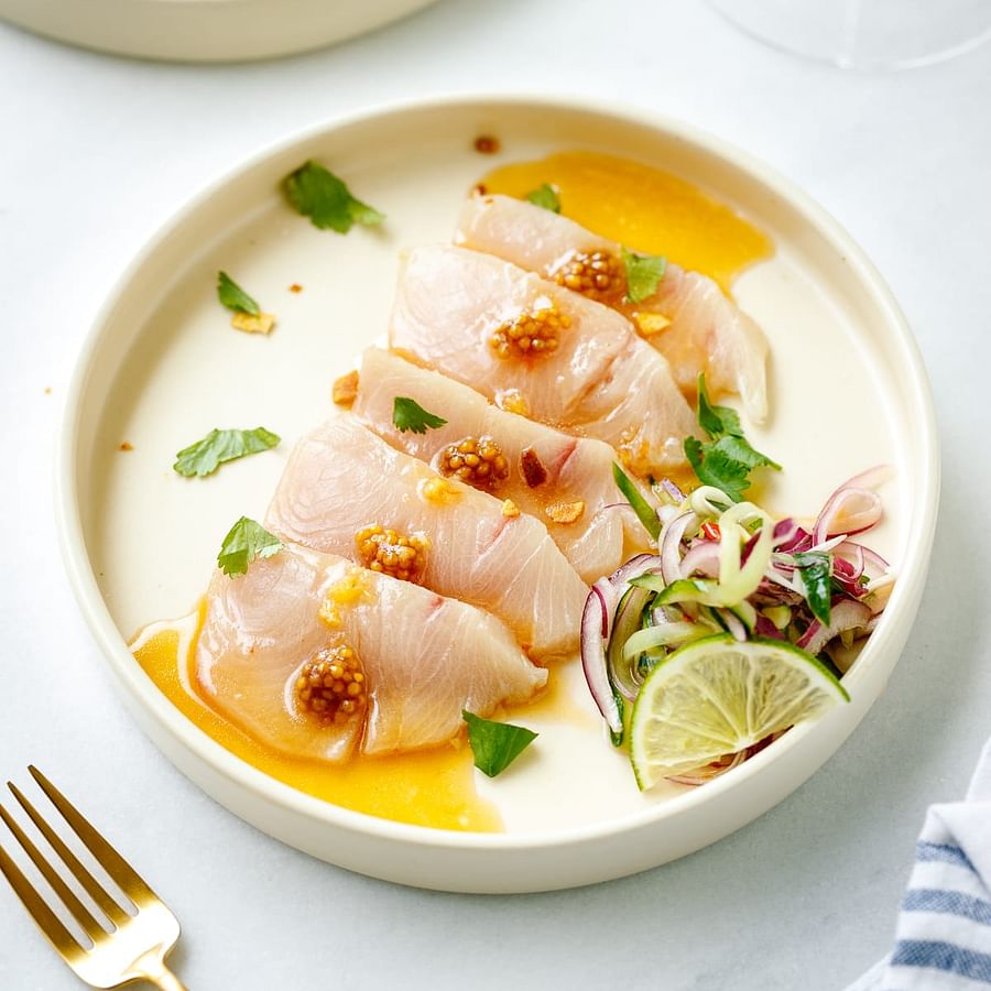 Elegant plate of Hamachi Sushi garnished beautifully