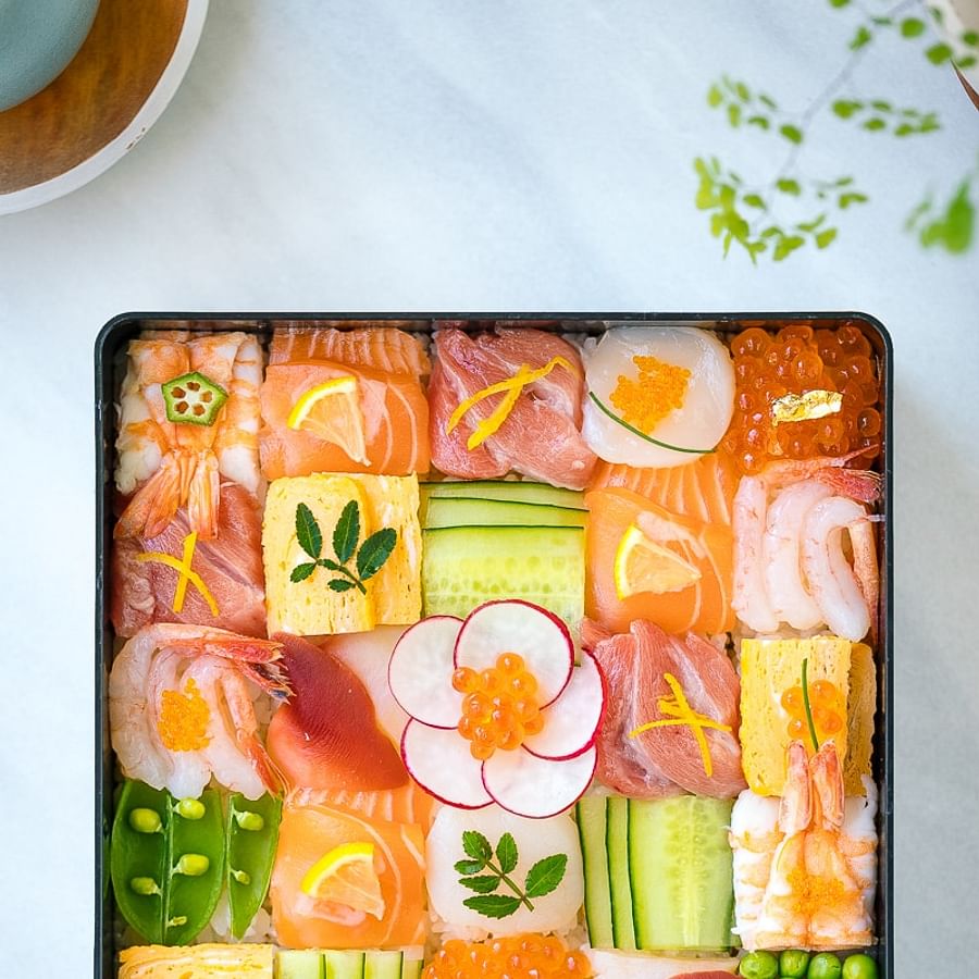 A vibrant plate of various roe sushi, showcasing different colors and textures