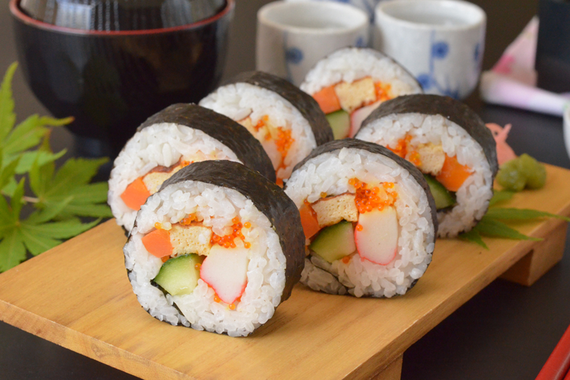Step-by-step process of assembling sushi roll using yaki sushi nori